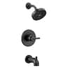 Matte black tub spout with wall-mounted trim ring and matching shower head outlet.