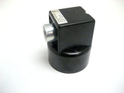 Black cylindrical level control switch with metal probe connection and white label on top.