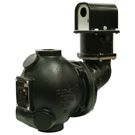 Black cast iron float-type low water cut-off valve with cylindrical body and vertical control head mounted on top.