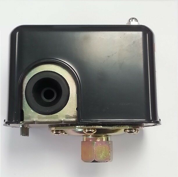 Black pressure switch with metal base, central diaphragm opening, and three brass connection ports on bottom.