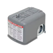 Gray Square D pressure switch with adjustment knob on top, warning label on front, and pulsating plug connection on side.