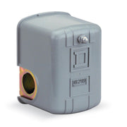 Gray square pressure switch with metal port opening and control knobs on front face.