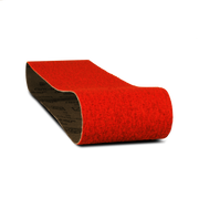 Red abrasive sanding belt with black backing, cylindrical form, 3 inches wide by 24 inches long.