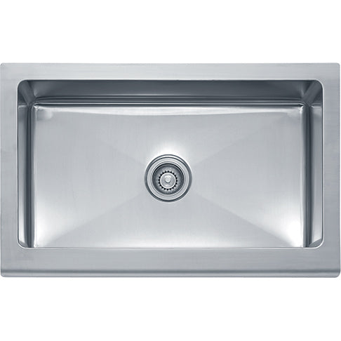Stainless steel apron front sink with single basin and chrome drain strainer.