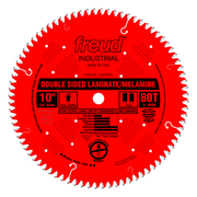 Red circular saw blade with white teeth and center hole, labeled "Freud Industrial" with "Double Sided Laminate/Melamine" and