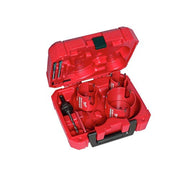 Seven hole saws of varying sizes with carbide teeth stored in a red plastic carrying case.