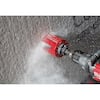 Milwaukee 10-piece hole saw kit with red and black bits and carbide teeth displayed on concrete surface.