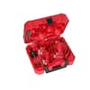 Red plastic case containing assorted hole saw bits with carbide teeth and accessories.