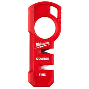 Red Milwaukee compact knife sharpener with coarse and fine sharpening slots and finger hole grip.