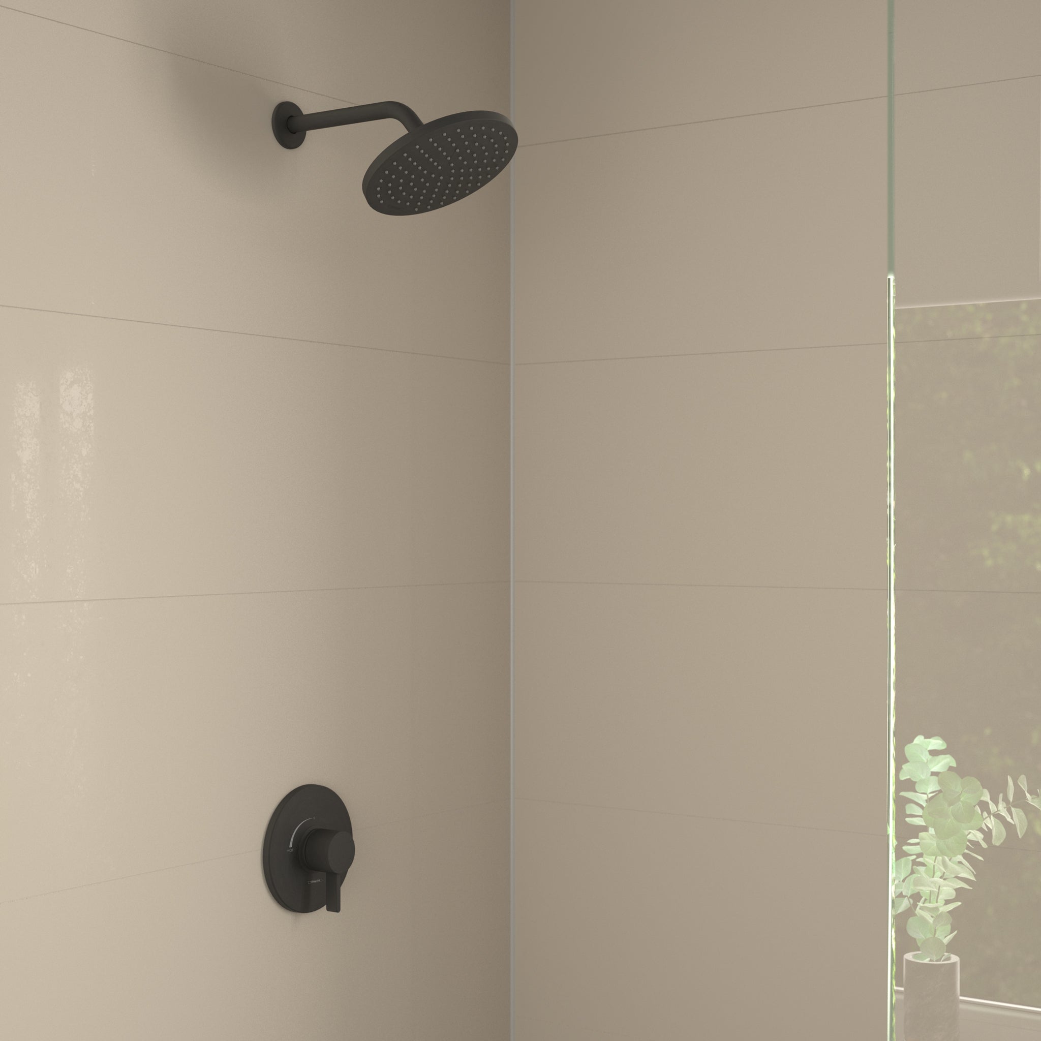 Matte black shower set with round overhead showerhead and wall-mounted pressure balance valve in tiled bathroom.