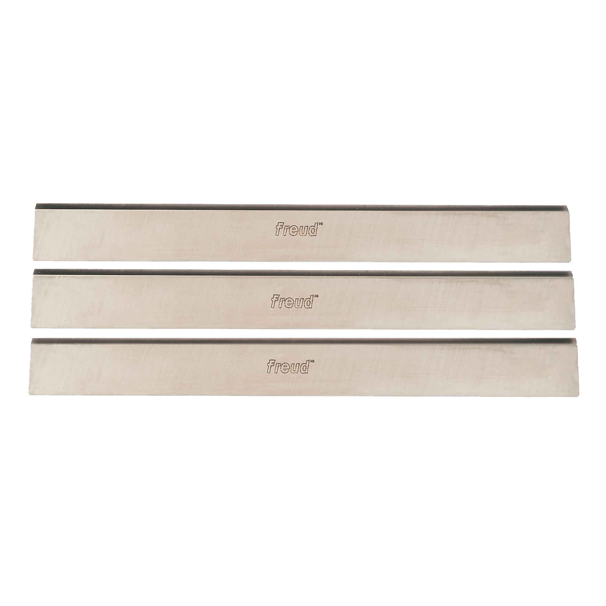 Three rectangular high speed steel planer knives with Freud branding, arranged horizontally.