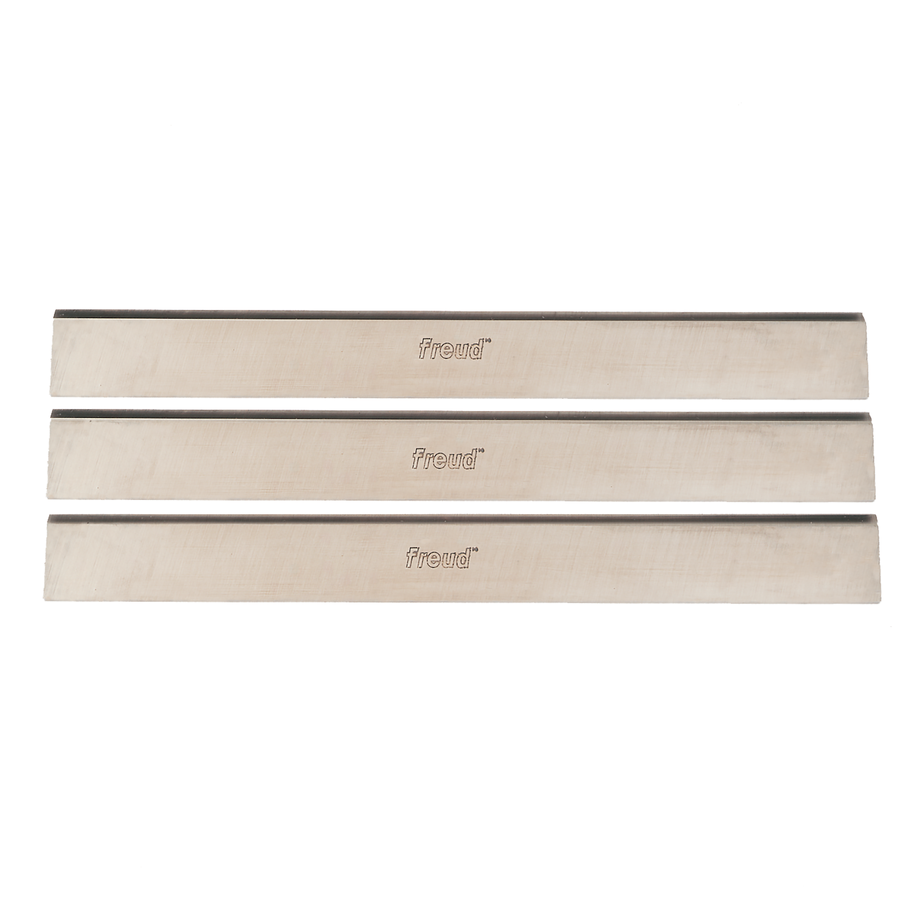 Three rectangular high speed steel planer knives with Freud branding, arranged horizontally.