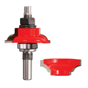 Freud router bit with red round-over bead profile and interchangeable cutting heads on steel shaft with bearings.