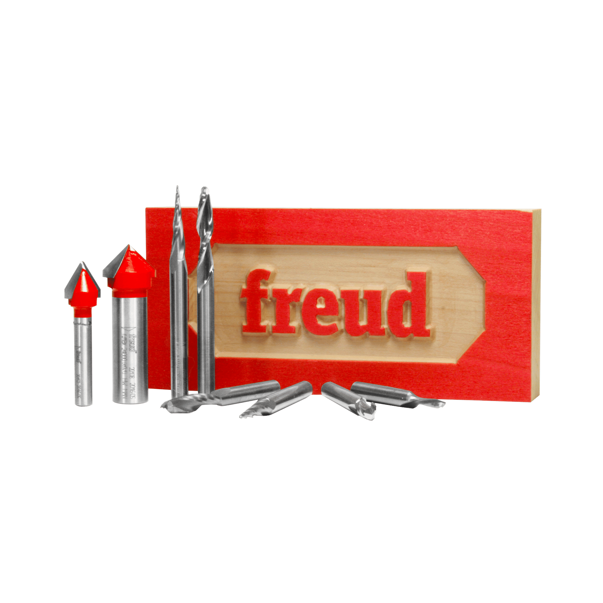 Eight CNC router bits with red and silver cutting heads arranged next to red box with wooden sample showing "freud" text.