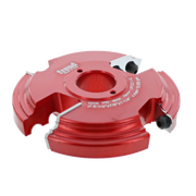 Red router cutter head with two white tool holders and central bore, featuring curved cutting edges on sides.