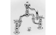 Polished chrome three-piece widespread bathroom sink faucet with curved spout and dual handles.