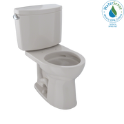 Beige two-piece toilet with round bowl, tank, and side lever handle, shown without seat.