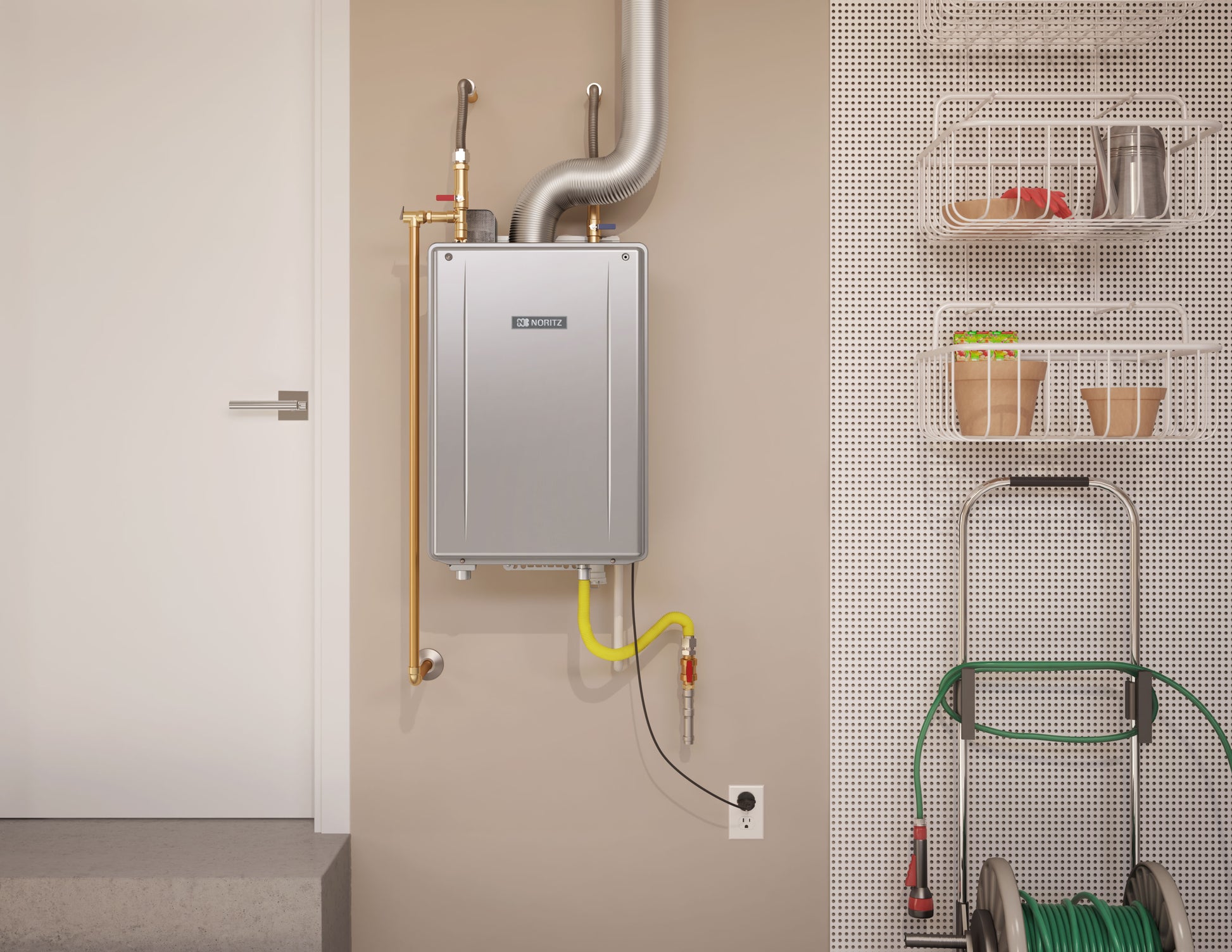 Noritz tankless water heater mounted on wall with metal exhaust pipe, brass fittings, and yellow gas line connections.