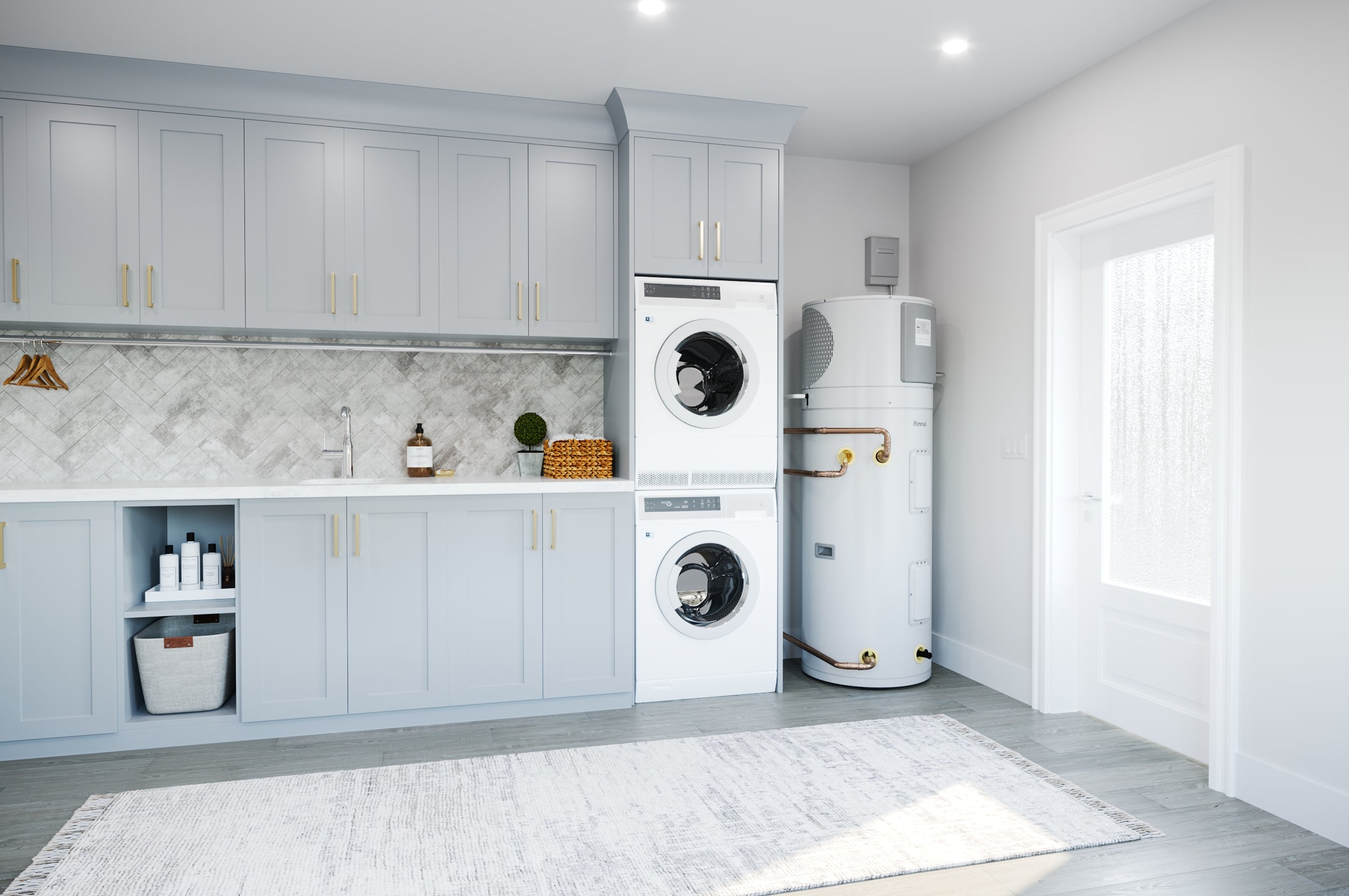 White cylindrical hybrid water heater installed in modern laundry room next to stacked washing machines.