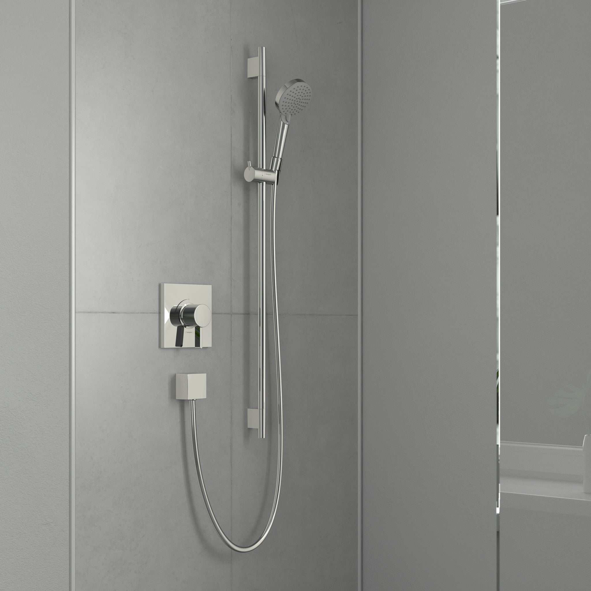 Chrome wallbar shower set with handheld showerhead, vertical rail, and dual control handles mounted on bathroom tile wall.