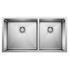 Stainless steel double-bowl undermount kitchen sink with two rectangular basins and drain openings.