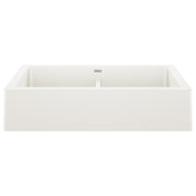 White double basin farmhouse sink with apron front and center divider.