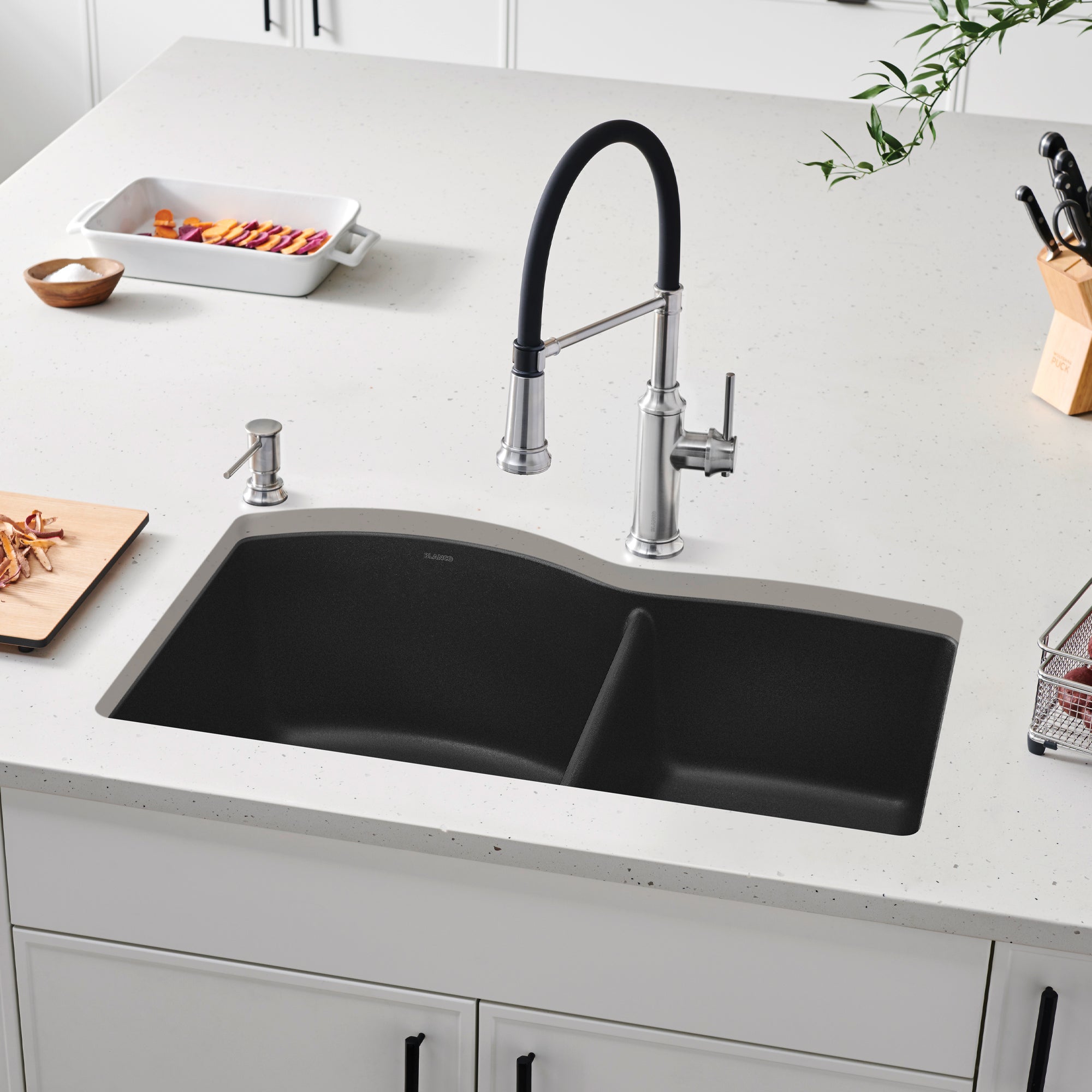 Anthracite drop-in kitchen sink with two bowls, stainless steel faucet with black pull-down sprayer, and soap dispenser insta