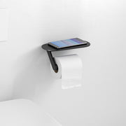 Matte black wall-mounted toilet paper holder with shelf holding a smartphone and roll of toilet paper.
