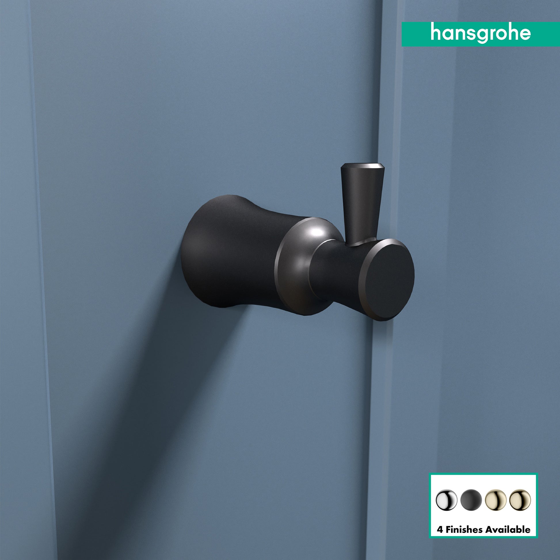 Matte black wall-mounted hook with cylindrical and rounded forms mounted on blue wall.