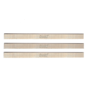 Three Freud high speed steel planer and jointer knives, each 12 inches long with sharp cutting edges.