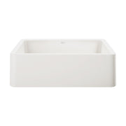 White rectangular apron front kitchen sink with curved sides and flat rim.