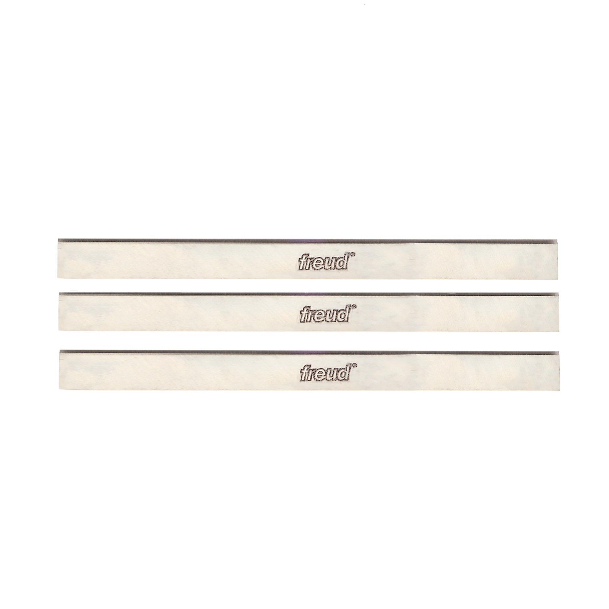 Three Freud 12-inch high speed steel planer and jointer blades with gray cutting edges and cream-colored bodies.