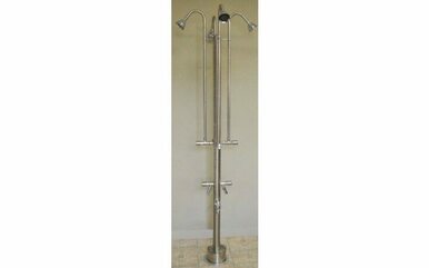 Stainless steel freestanding outdoor shower with four spray heads, foot shower valve, and hose faucet attachment on vertical 