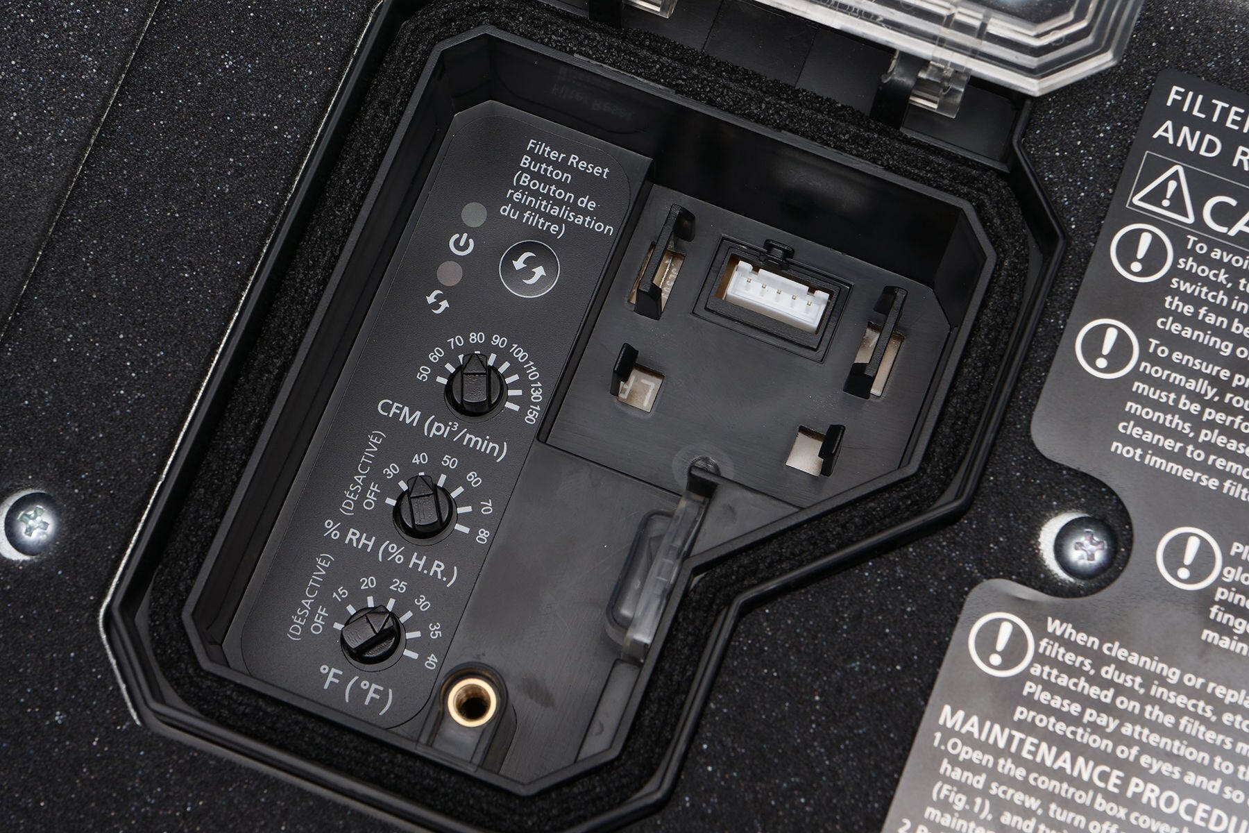 Black control panel with power button, filter reset indicator, speed dial, humidity sensor, and temperature display with inst