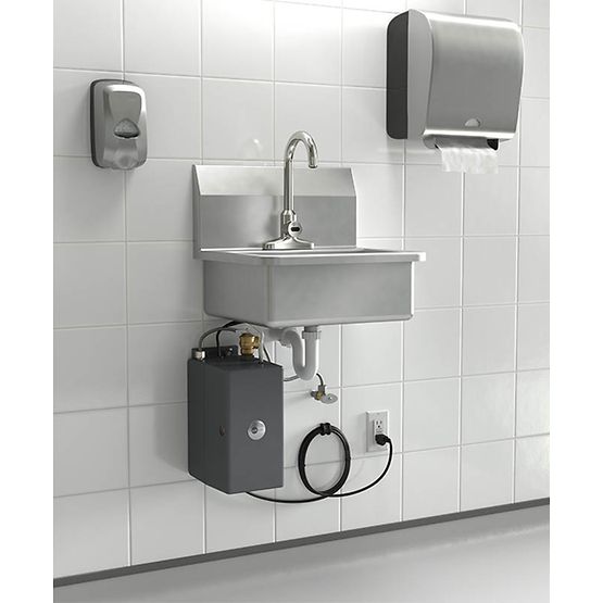 Chrome handwashing system with stainless steel sink, faucet, and black heating unit mounted on white tiled wall with paper to