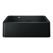 Coal black double bowl farmhouse sink with rounded corners and low center divider.