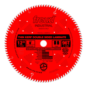 Red circular saw blade with 96 teeth, 12 inch diameter, labeled Freud Industrial thin kerf double sided laminate blade.