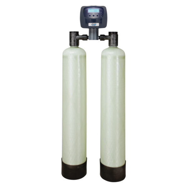 Dual tall cylindrical water filter tanks with black control valve head and digital display unit mounted on top.