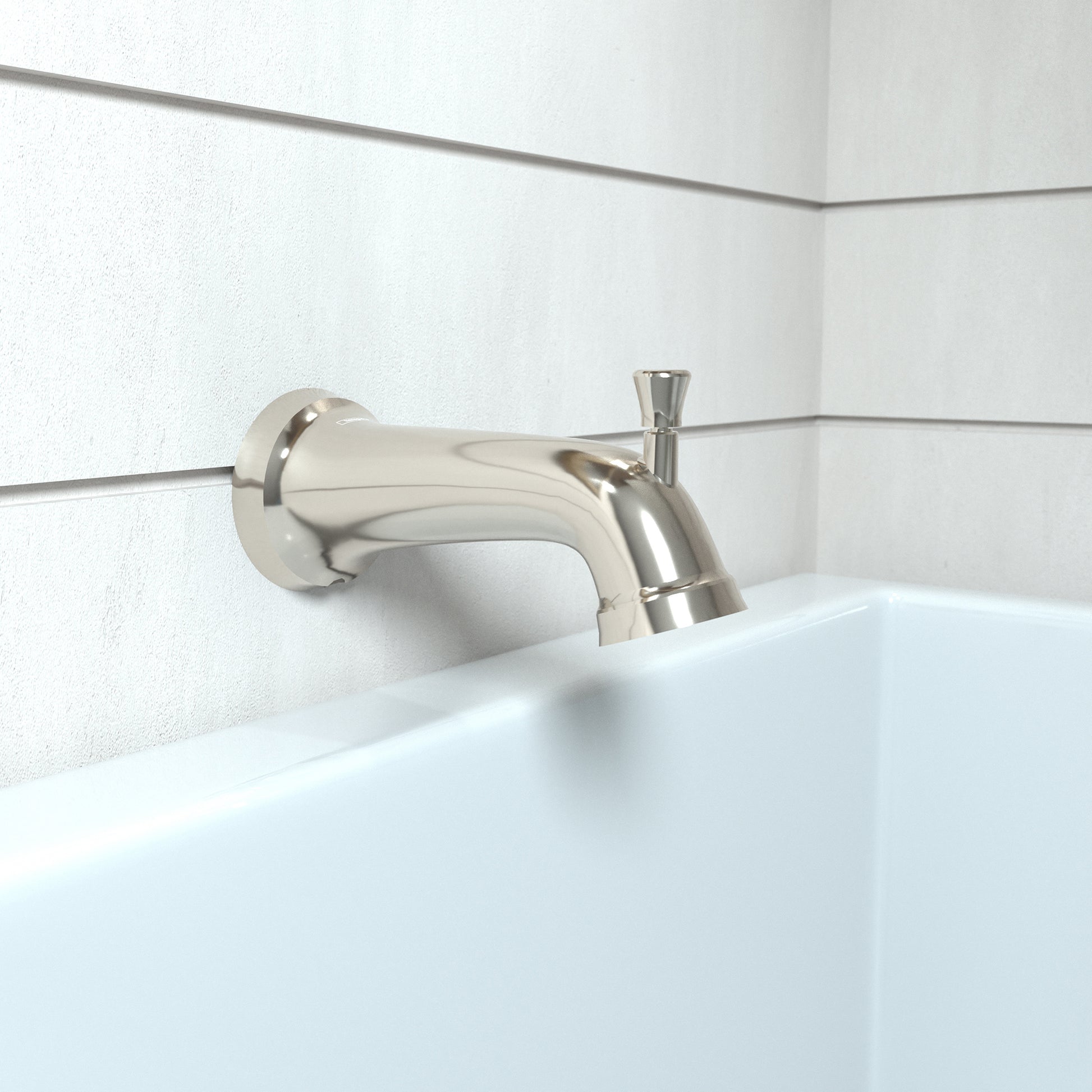 Polished nickel tub spout with diverter mounted on white tile wall above bathtub edge.