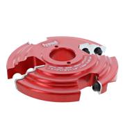 Red router cutter head with curved cutting profiles, center bore, and adjustment screws mounted on sides.
