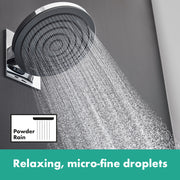 Matte black circular shower head with chrome trim mounted on wall bracket, dispensing water spray.