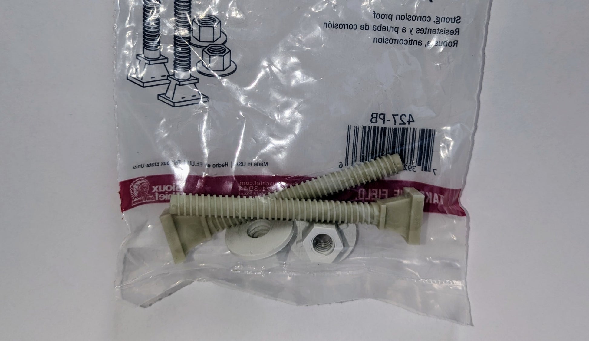 Plastic closet bolts with white washers and nuts in clear plastic bag with red label.