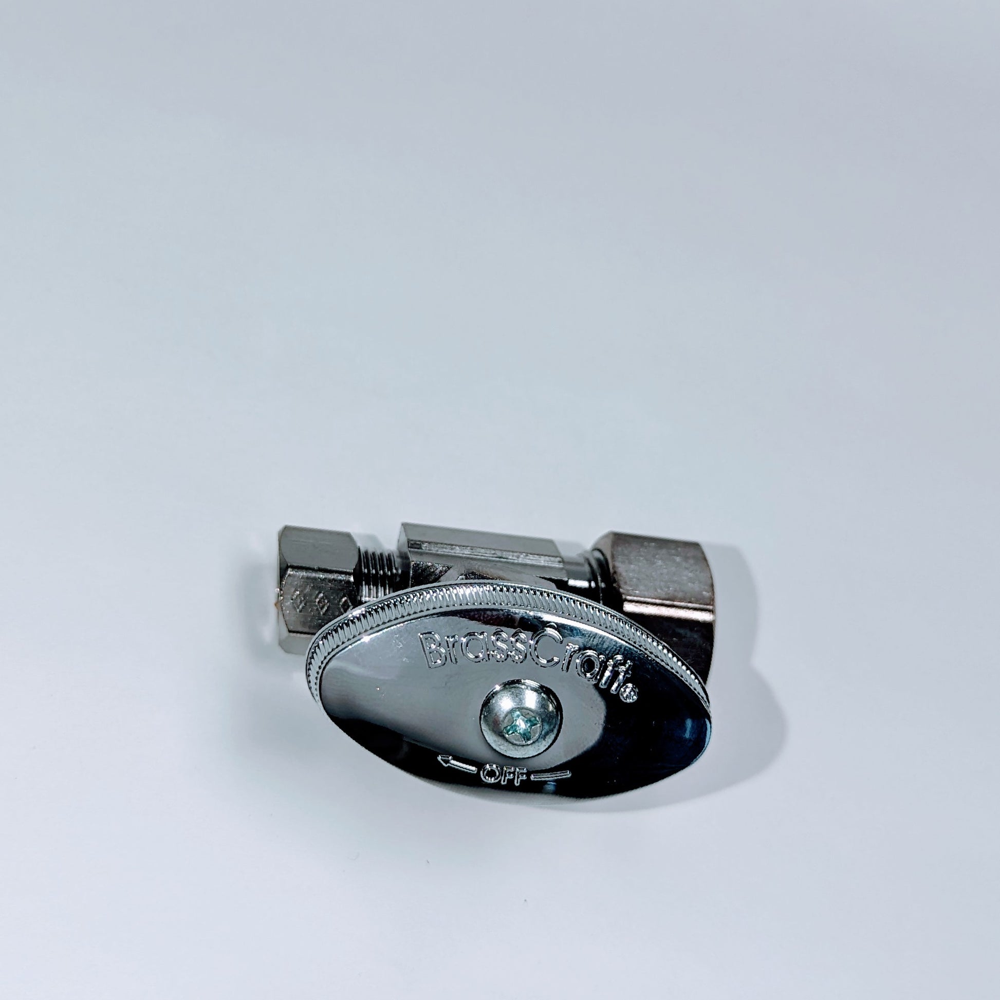 Chrome straight valve with two compression fittings, one larger and one smaller, shown from above against white background.