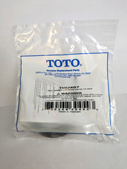 Toto THU407 seal gasket for drain valve tower in clear plastic packaging with blue TOTO branding and barcode label.