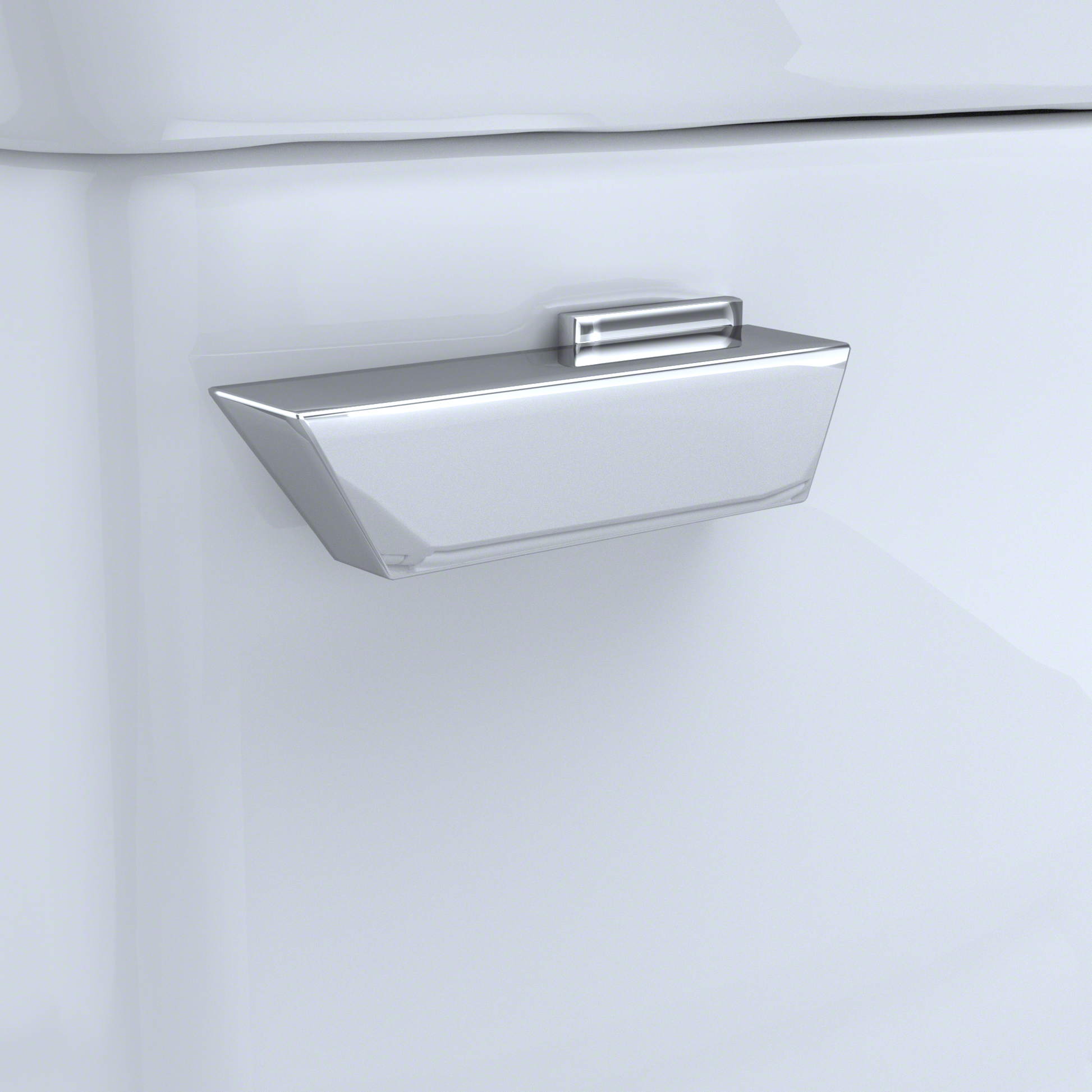 Polished chrome trip lever mounted on white toilet tank with rectangular handle design.