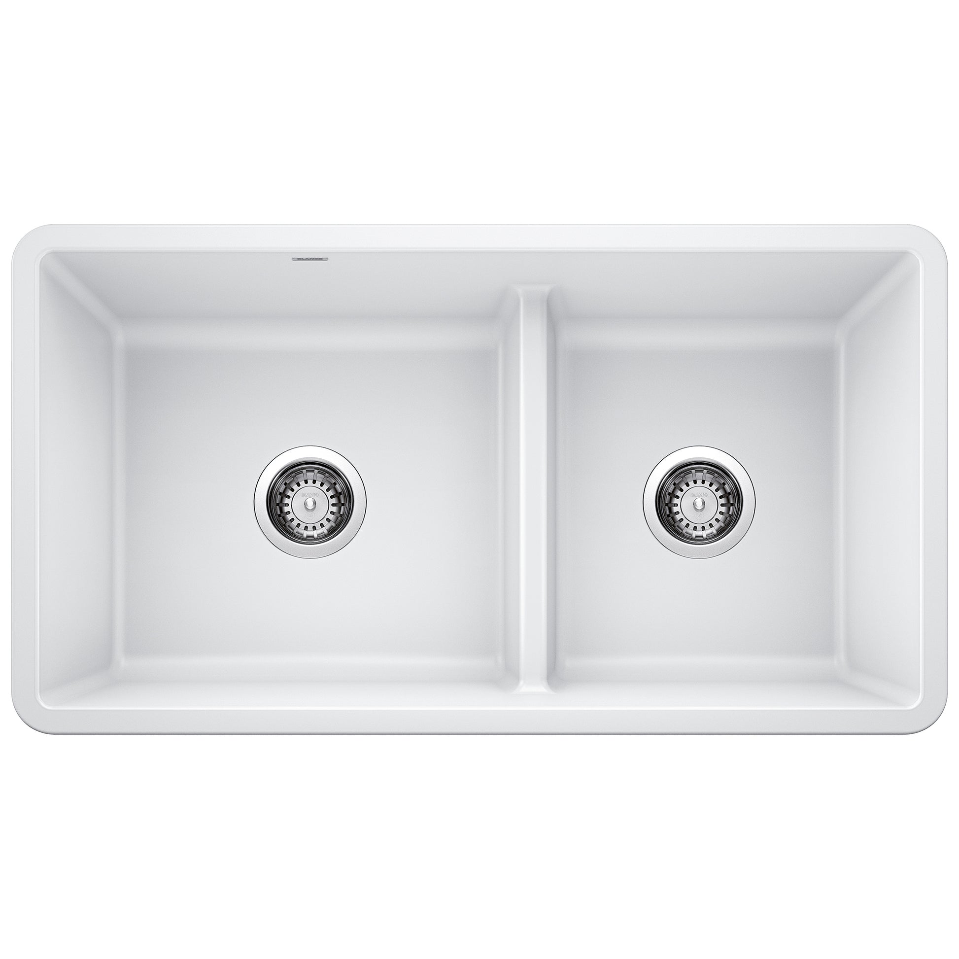 White double bowl undermount kitchen sink with low divide and chrome drain strainers.