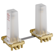 Two-handle freestanding tub filler rough-in with brass mounting bases and white cartridge housings connected by metal bar.