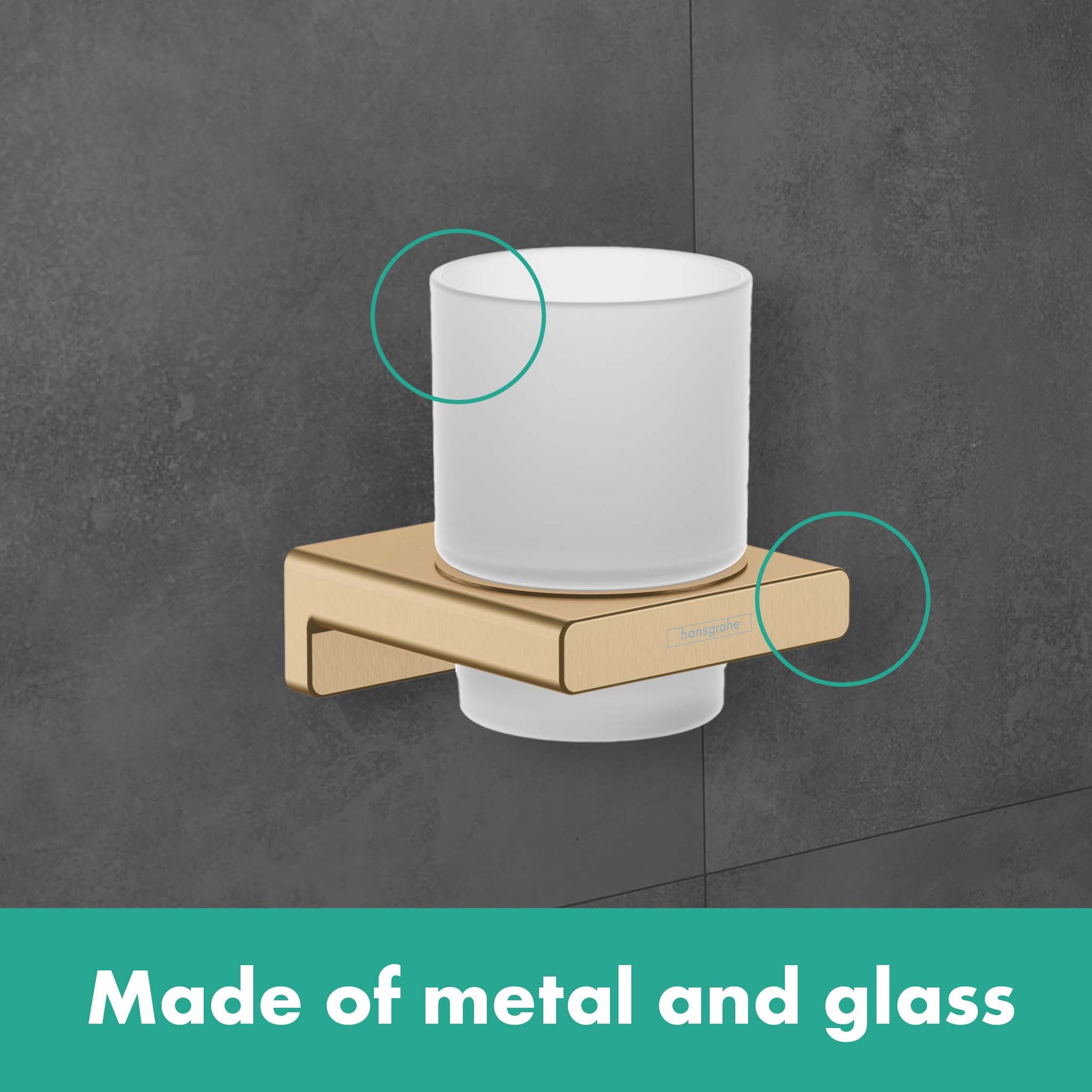 Chrome tumbler holder with white ceramic cup mounted on brushed metal bracket attached to gray wall.