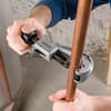 Black plastic handle attachment being installed on gray power tool body.
