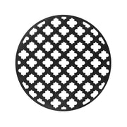 Round matte black drain cover with quatrefoil cutout pattern, 5 inches diameter.
